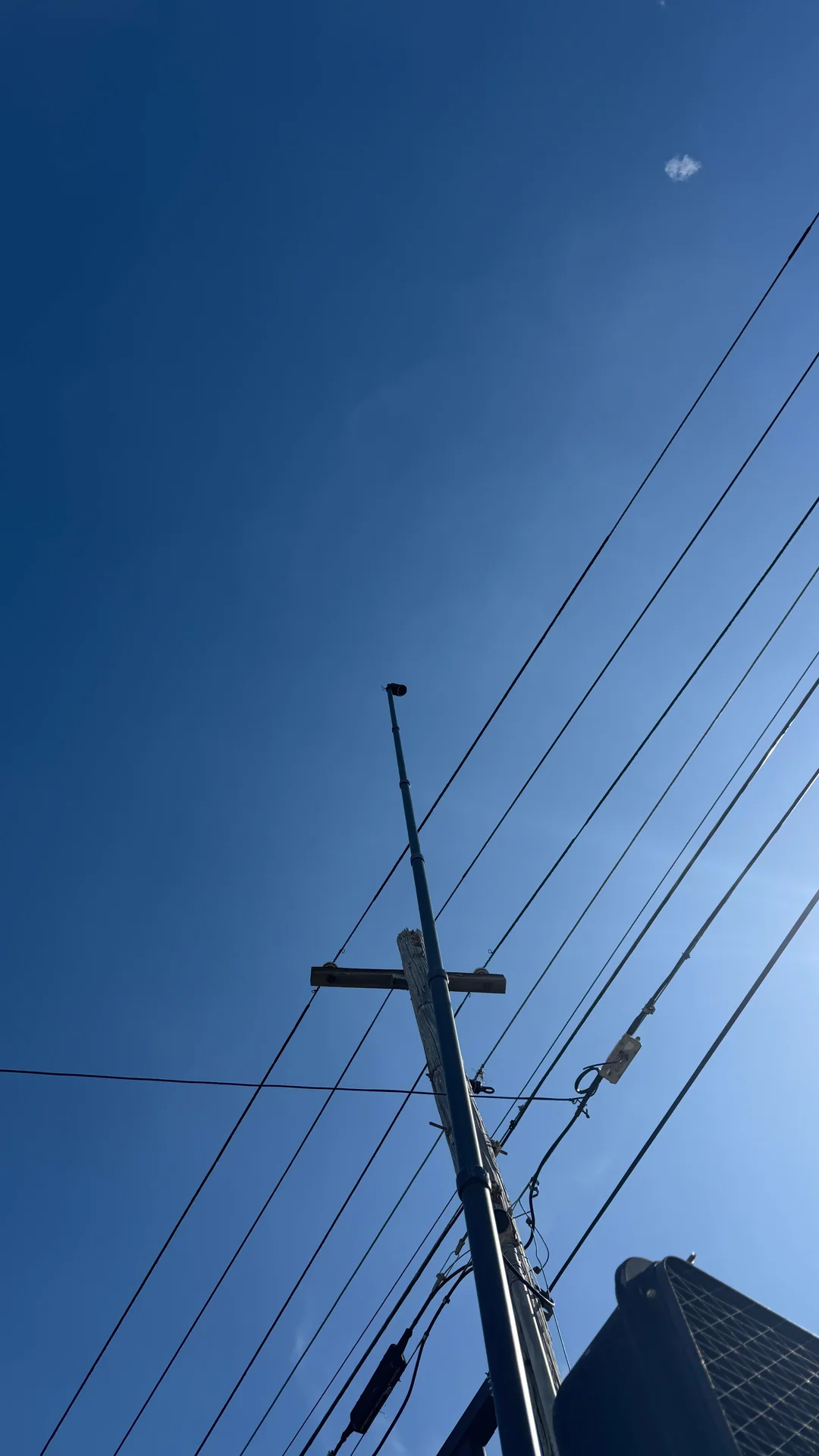 Scout Plus camera mounted on utility pole with power lines